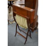 An Edwardian mahogany folding work table.