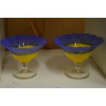 A pair of colourful sundae glasses.