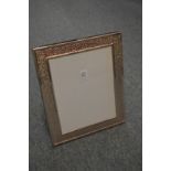 A large silver plated photograph frame.