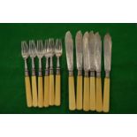 A set of six bone handled silver fish knives and forks.