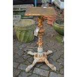 A pair of painted cast iron table stands.