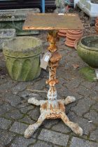 A pair of painted cast iron table stands.