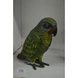 A painted spelter model of a parrot.