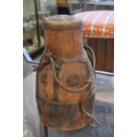 A Masai wooden and animal skin drum.