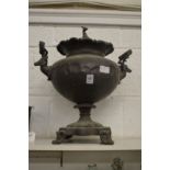 A copper samovar, the lid with greyhound finial, the handles modelled as stags heads.