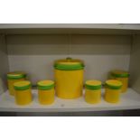 Carltonware storage jars, yellow ground with green rims.