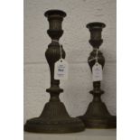 A pair of brass candlesticks.