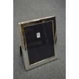 A large silver plated photograph frame.