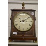 A Regency brass inlaid mahogany bracket clock with pineapple finial, the circular dial signed Thomas