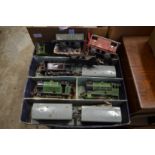 A small collections of 'O' gauge clockwork trains and carriages.