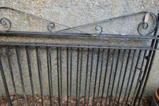 A pair of black painted wrought iron driveway gates each measuring 120cm high x 153cm wide.