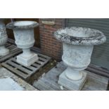 A good pair of carved Italian white marble Campagna urns on stands, the urns 92cm high, the pedestal