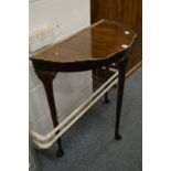 A demi lune side table.