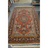 A good Persian floral decorated carpet 220cm x 138cm.