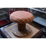 An unusual large circular foot stool made from a cable drum.