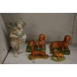 Capodimonte porcelain models of dachshund's, together with a Lladro figure of a boy and donkey.