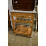 A marble top hardwood kitchen trolley.