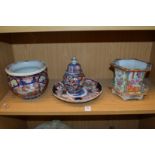 A Chinese famille rose hexagonal shaped jardiniere stand and three pieces of Imari porcelain.