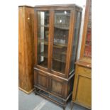 An oak cupboard bookcase.