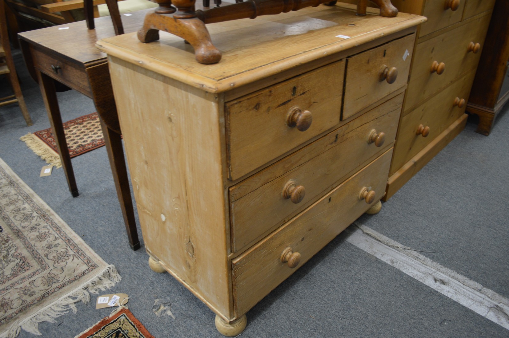 A small Victorian pine chest of drawers.