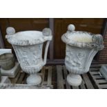 A large impressive pair of Italian carved white marble twin handled urns, one repaired 110m high.