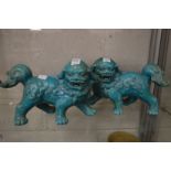 A pair of Chinese style turquoise glazed lion dogs.