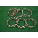 A set of six chain link style plated napkin rings.