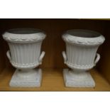 A pair of Casa Pupa urn shaped jardinieres or vases.