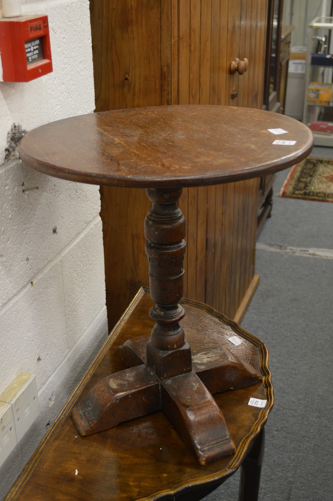 A circular oak occasional table.