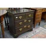 A small oak chest of drawers.