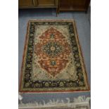 A Persian part silk rug with stylised floral decoration 135cm x 81cm.