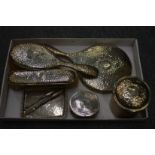 A silver dressing table set engraved with the initals H.A.B.