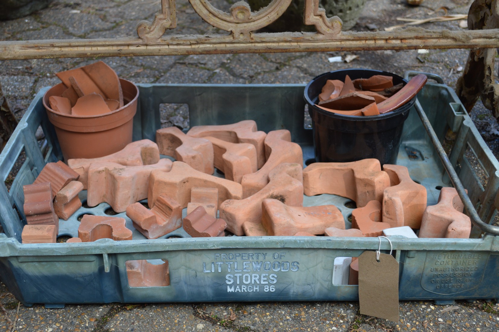A quantity of terracotta plant pot feet.