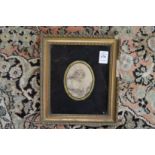 An oval engraving of a young lady in verre eglomise frame.