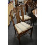 A pair of hepplewhite style mahogany dining chairs.