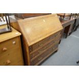 A George III oak and mahogany banded bureau.