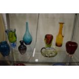 Colourful art glass vases and dishes.