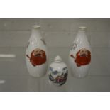 A Chinese painted porcelain snuff bottle and a pair of Chinese porcelain vases.