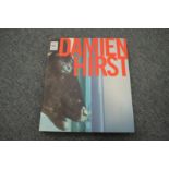 A Damien Hirst book, bears signature.
