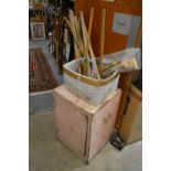 Croquet equipment and an old tin storage cabinet.