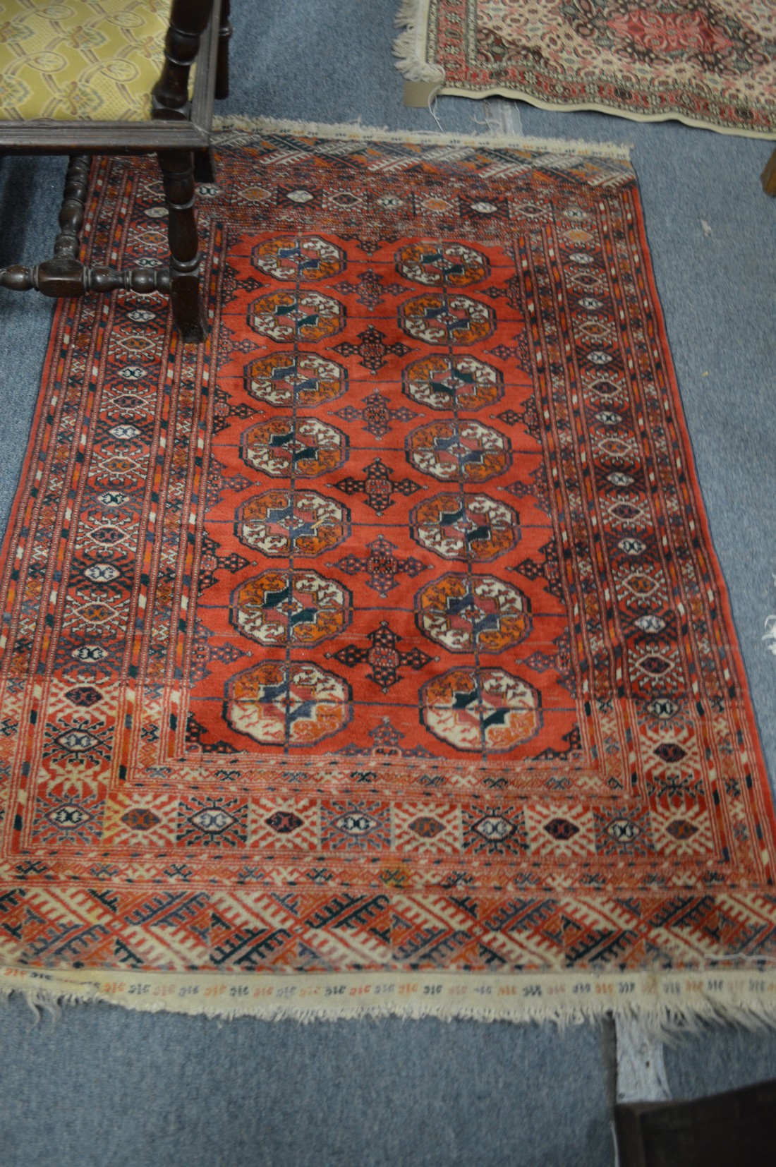 A Bokhara rug, 160cm x 105cm together with two small rugs.