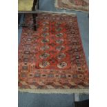 A Bokhara rug, 160cm x 105cm together with two small rugs.