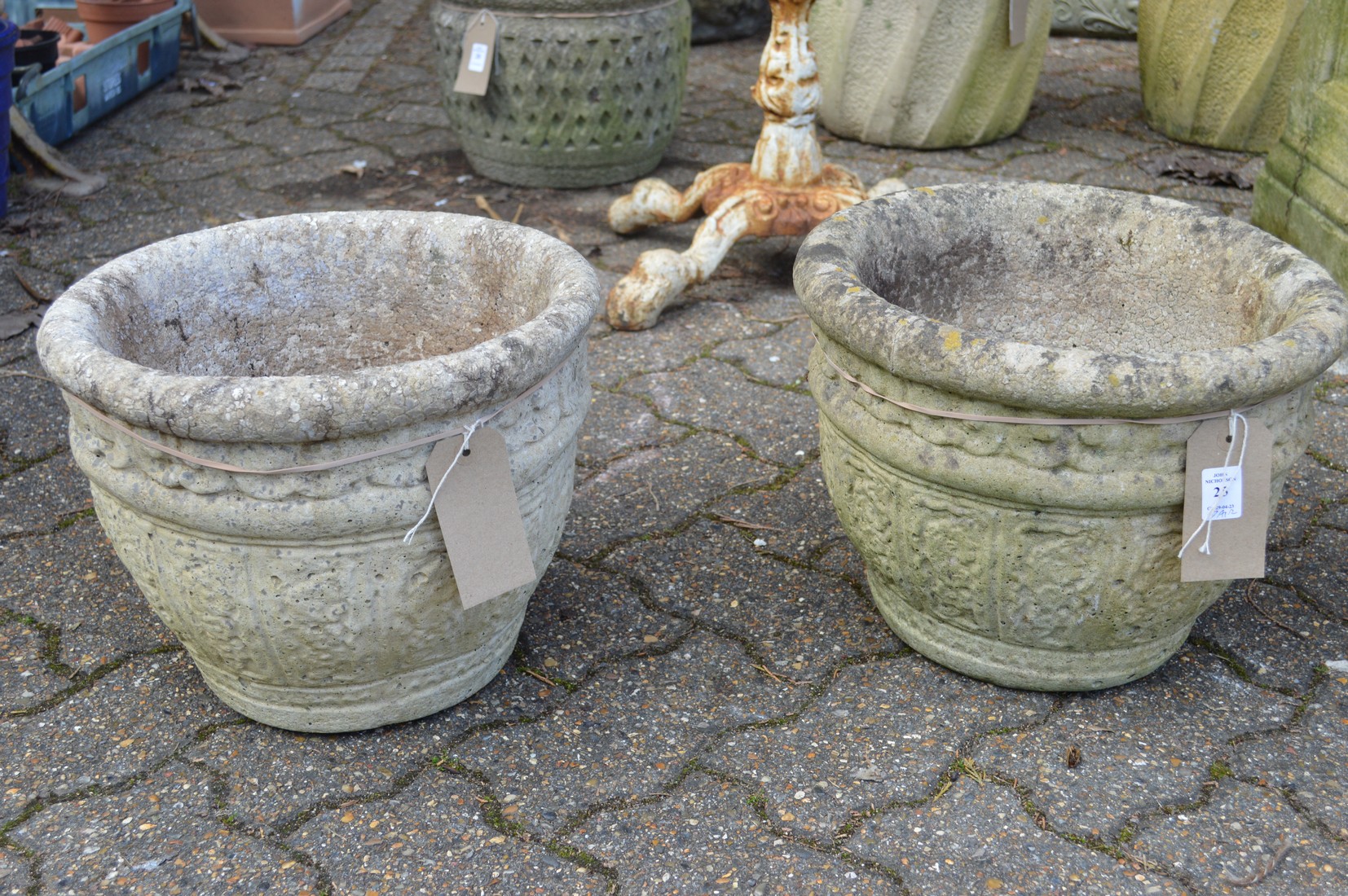 A pair of composite garden planters.