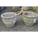 A pair of composite garden planters.