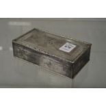 A silver table cigarette box with engine turned decoration, the hinged cover with Royal Fifer and