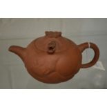 A Chinese Yixing teapot.