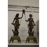 A pair of spelter figures on onyx bases.