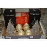 Frosted glass Christmas tree models, pinecone candle holders and a pair of glass angels.