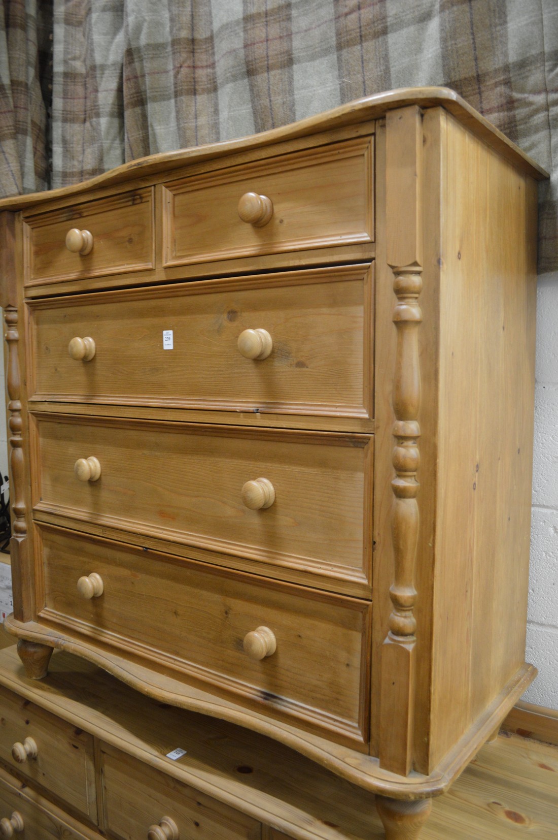 A pine chest of drawers.