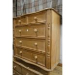 A pine chest of drawers.